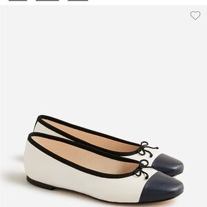 Gently worn J. Crew cap-toe ballet flats in ivory and navy